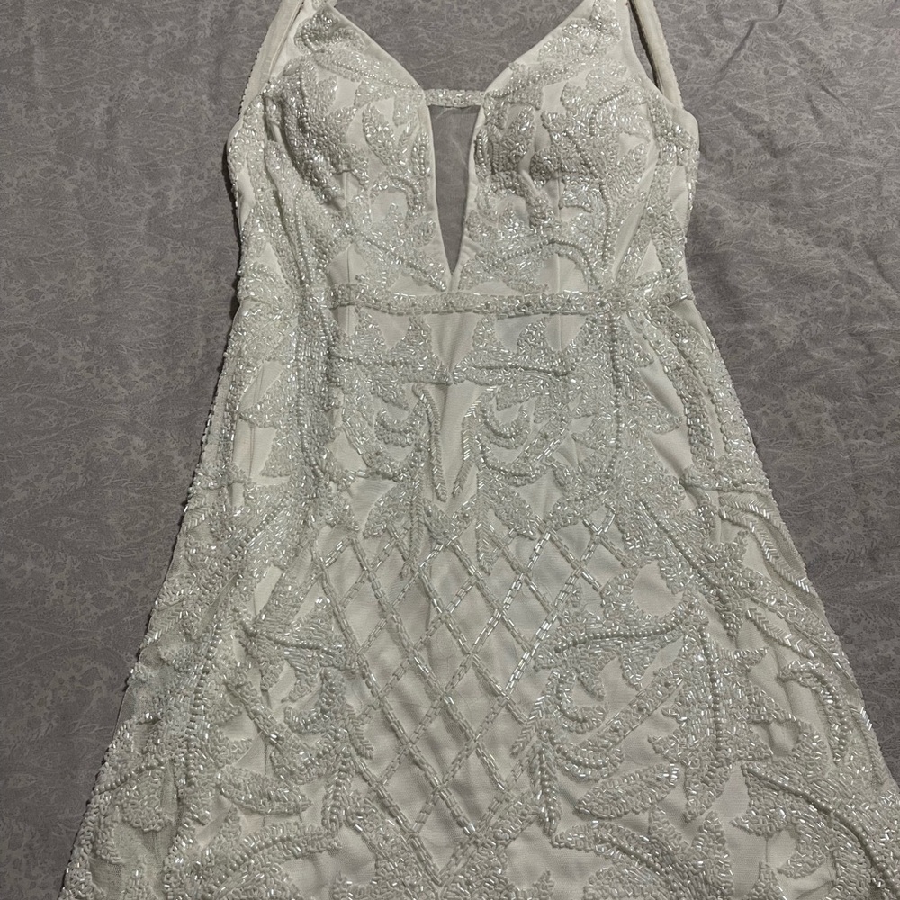 Polyester
Back zipper; fully lined. Only wore it once. Like new